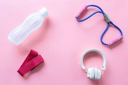 Sports equipment items on pink background, flat lay.の写真素材