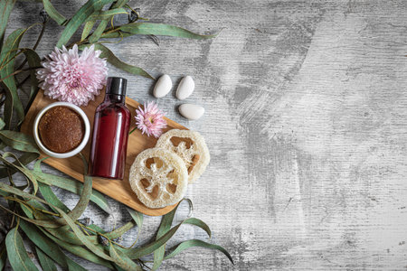 Flat lay spa composition with body products on textured concrete background.の写真素材