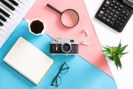 Vintage retro camera on a colored background, flat lay, minimalism.の写真素材