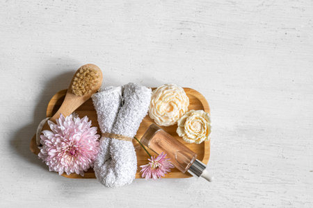 Body scrub and other care products on a wooden plate, isolated.の写真素材