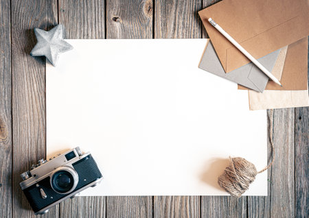 Flat lay background with retro camera and letters on wooden surface.の写真素材