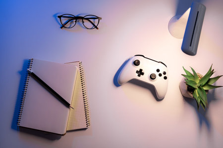 Flat lay, gamepad on the desktop at night.