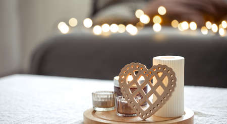 Cozy background for Valentines Day with decorative heart and candles.の写真素材