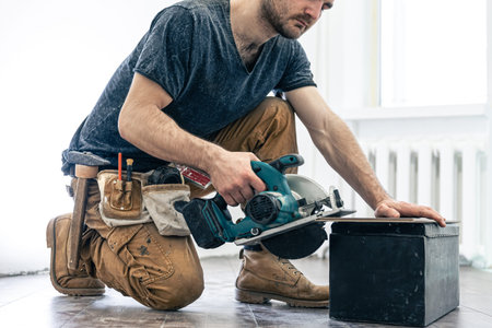 Circular Saw, carpenter using a circular saw for wood.