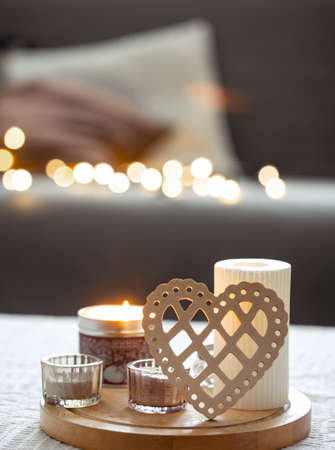 Cozy background for Valentines Day with decorative heart and candles.の写真素材