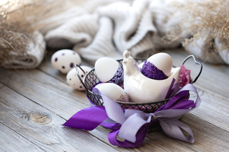 Easter composition with eggs, decorated with purple sparkles.の写真素材