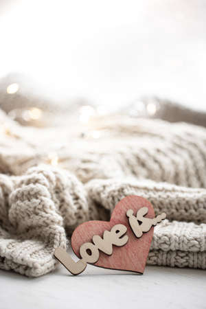 A decorative heart among cozy knitted items. Valentines Day holiday concept.の写真素材