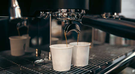 The process of preparing espresso in a professional coffee machine, close-up.の写真素材