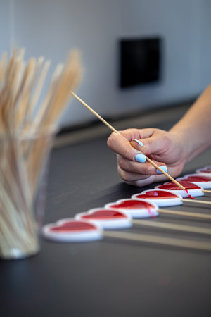 Close-up, the process of making lollipops from natural ingredients.