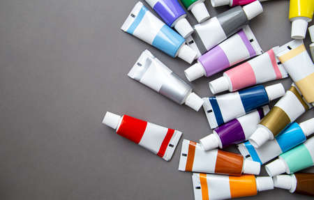 Tubes of acrylic paint in different colors, flat lay.の写真素材