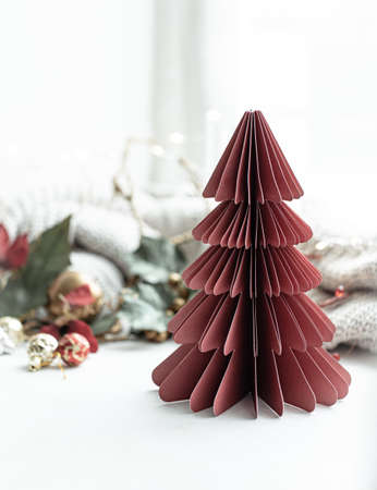 Festive background with decorative cardboard Christmas tree, copy space.の写真素材
