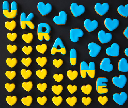 The word Ukraine on a black background, made with handmade gingerbread.の写真素材