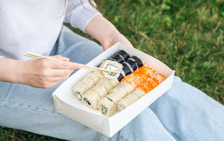 Close up of sushi in box at picnic, sushi delivery concept.の写真素材