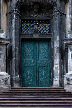 Ancient doors in the cathedral, turquoise old doors.の写真素材