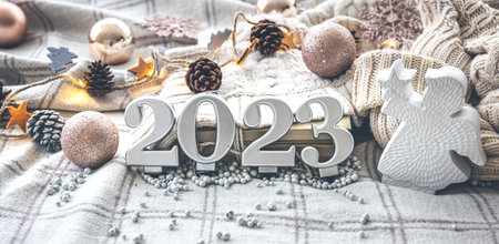 Christmas cozy background with numbers 2023 and decor details.