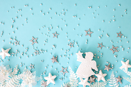 Flat lay, blue Christmas background with decor details.