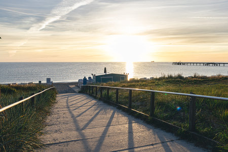 Sea embankment at sunset with a clear cloudless sky.
