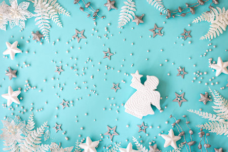 Flat lay, blue Christmas background with decor details.