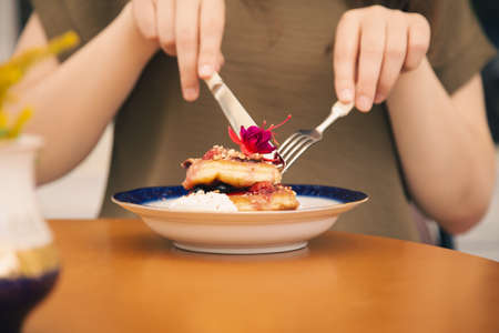 Appetizing pancakes decorated with berries and flowers.の写真素材