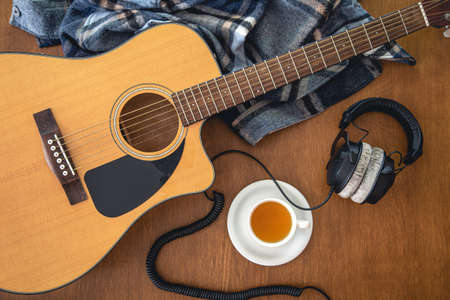 Music background with acoustic guitar, top view.の写真素材