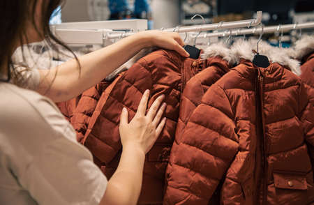 Childrens jackets on hangers in a clothing store.の写真素材