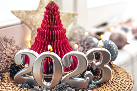 Christmas background with decorative candles 2023 and decor details.