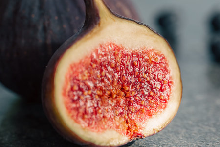 Close-up, fig fruit on a blurred dark background.