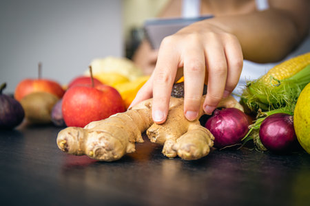 Close-up, ginger root on the kitchen table.の写真素材