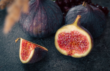 Close-up, fig fruit on a blurred dark background.の写真素材