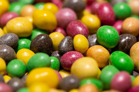 Peanuts covered with multicolored glaze, close up.の写真素材