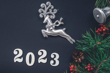 Christmas background with numbers 2023 and decor details, flat lay.
