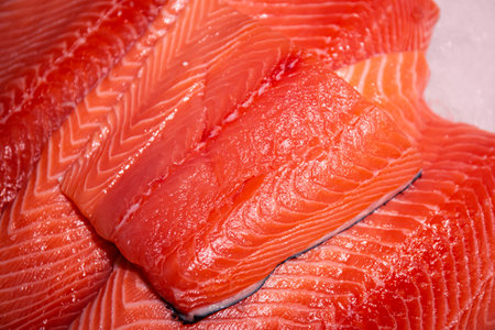Raw salmon, trout close-up on the showcase of a seafood store.の写真素材