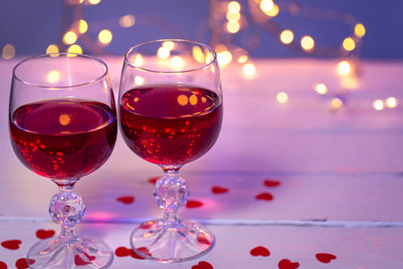 Background with glasses of wine, romantic dinner for Valentines day concept.の写真素材