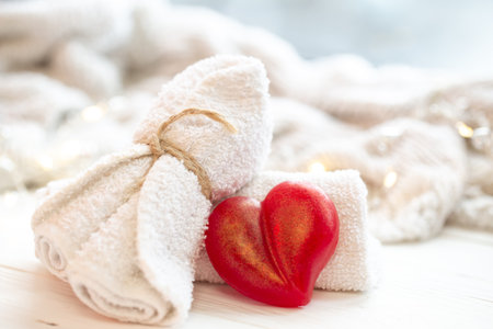 Spa composition with heart shaped soap towel close up.の写真素材
