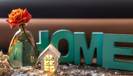 Cozy composition with decorative word home, flower and candle.の写真素材