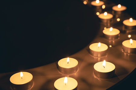 Burning candles in the bathroom in the dark.