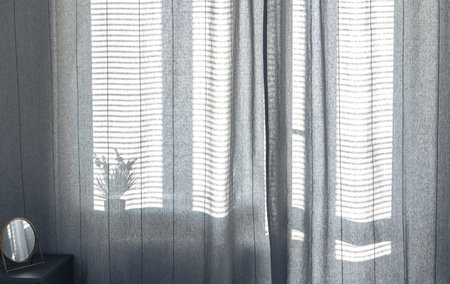 Room interior with curtains and blinds in sunny weather, shine the shadows.の写真素材