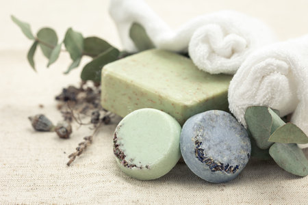 Close-up, round multi-colored handmade soap on a blurred background.
