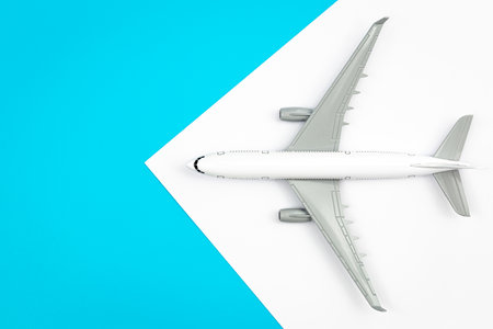 A plane, airplane on a blue background, flat lay, copy space, travel concept.の写真素材