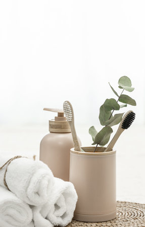 Spa composition with bamboo eco brushes on a white background and other personal hygiene items, copy...
