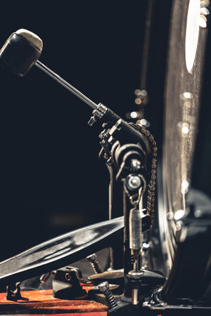 Bass drum with pedal, musical instrument on black background.の写真素材