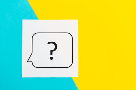 Question mark on yellow and blue background, flat lay.の写真素材