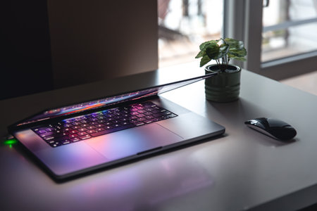 Close up of laptop keyboard colorful neon illumination, backlit keyboard.の写真素材