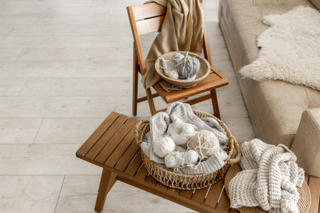 Threads for knitting in the interior of the room, a cozy composition with yarn.