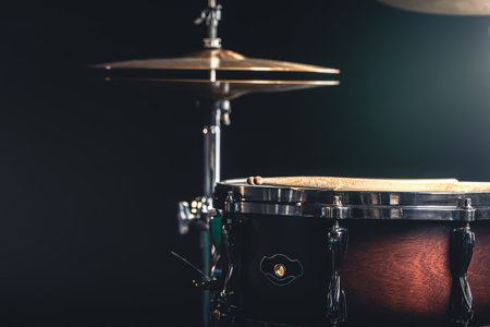 Snare drum and cymbals on a black background.の写真素材