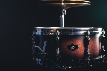 Beautiful snare drum on a black background, close up.の写真素材