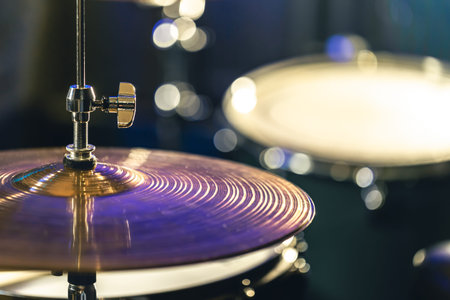 Drum cymbal close-up on a dark blurred background.の写真素材