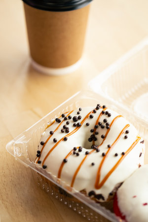 Beautiful appetizing donut and a cup of coffee, close-up.の写真素材