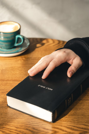 Close-up, a man reads the Bible in the morning.の写真素材