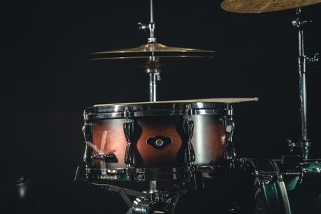 Drums on a black background close-up, percussion instrument on stage.の写真素材